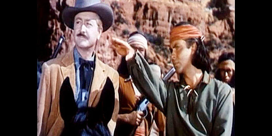 Jack Buetel as Charlie Wolf, pointing out a signal spot to Dan Craig (Robert Young) in The Half-Breed (1952)