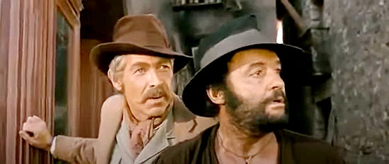 James Coburn as John Mallory, explaining to Juan Miranda why there were political prisoners, not money, in the bank they attacked in A Fistful of Dynamite (1971)