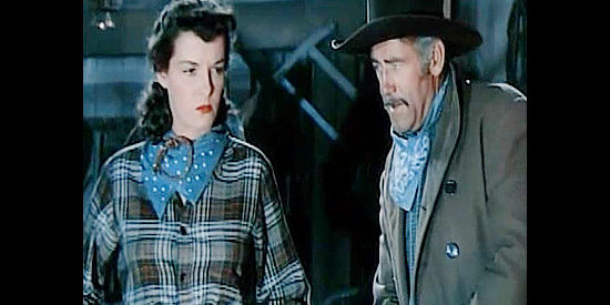 Jane Russell as Belle Starr, trying to figure out her next move with fellow outlaw Jim Clark (Roy Barcroft) in Montana Belle (1952)