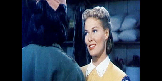 Janis Carter as Helen Dalhen, flirting with Charlie Wolf to make Dan Craig jealous in The Half-Breed (1952)