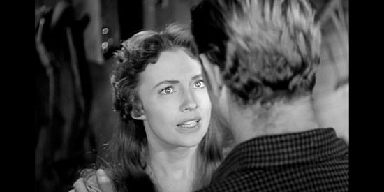 Joan Leslie as Ellen Hanley, wondering if husband Gil wants to stay in an area where he won't be forgiven for fighting for the South in Hellgate (1952)