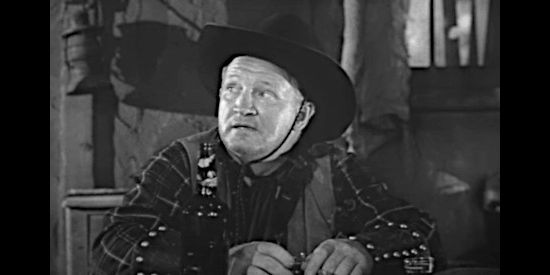 Joe Sawyer as Eli Cressett, wondering if he's on right side as the double crosses mount in Deputy Marshal (1949)