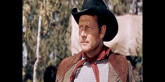 Joel McCrea as Will Owens, torn between duty and compassion as he's supposed to lead a caravan of civilians into ambush in The Outriders (1950)
