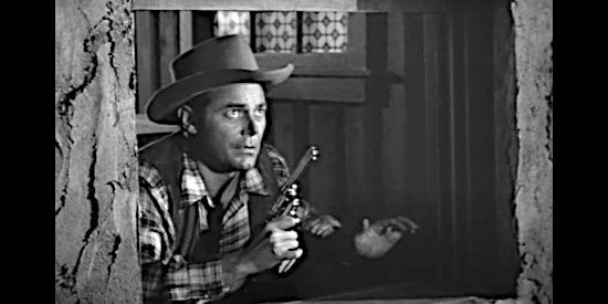 Jon Hall as Deputy Marshal Ed Garry, looking for whomever just shot his companion through a saloon window in Deputy Marshal (1949)