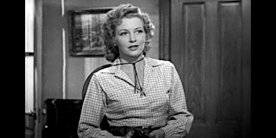 Julie Bishop as Claire Benton, deciding it's time to take matters in her own hands in Deputy Marshal (1949)