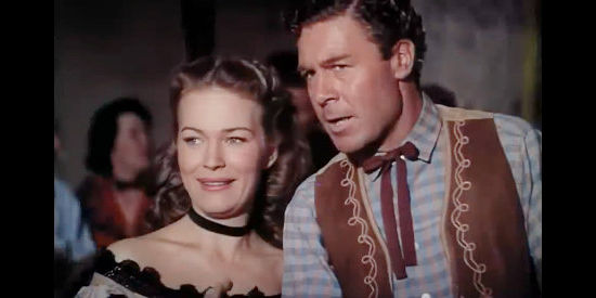Kristine Miller as Abby Davis and John Archer as Pat Ferrell, lovers split apart by the arrival of a mysterious stranger in High Lonesome (1950)