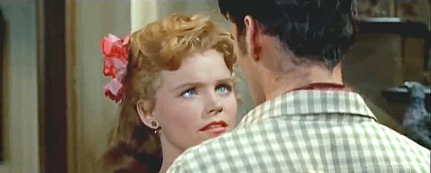 Lee Remick as Callie, a saloon girl with a past falling for a handsome young Lat Evans in These Thousand Hills (1959)