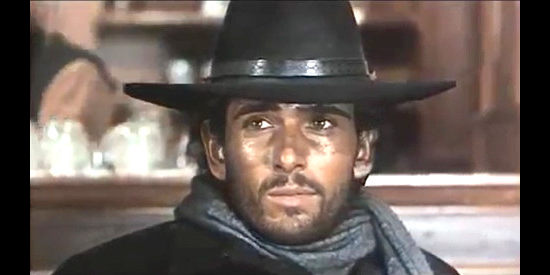 Leonard Mann as Chuck Moll, traveling to a town where he hopes to find his past in The Unholy Four (1970)
