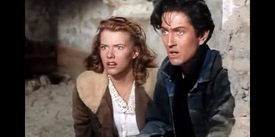 Lois Butler as Meagan Davis and John Barrymore as Cooncat, in a desperate situation in High Lonesome (1950)