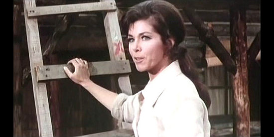 Marianne Koch as Julie Harrison, the woman who's learned to survive without her husband in Clint, the Nevada's Loner (1967)