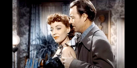 Marie Windsor as Doll Brown, trying to convince Zeb Smith (William Elliott) to give up religion for her in Hellfire (1949)