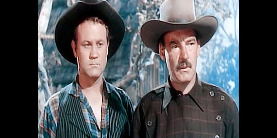 Mike Ragan as Ben Dalton and Ray Teal as Emmett Dalton, more than a bit anxious about having Belle Starr share their hideout in Montana Belle (1952)