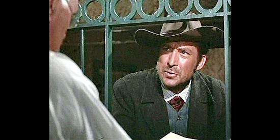 Mirko Ellis as Moxon, posing as a cattleman during a bank robbery in Hate for Hate (1967)