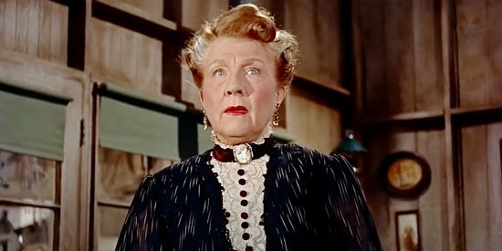 Nana Bryant as Mrs. Banner, the older woman who befriends Judy Polsen in The Outcast (1954)