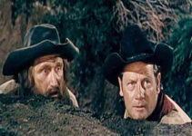 James Whitmore as Clint Priest and Joel McCrea as Will Owens, looking for a way out of a tough situation in The Outriders (1950)