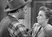 Jon Hall as Ed Garry, getting forceful with Claire Benton (Julie Bishop) in Deputy Marshal (1949)