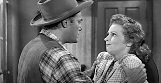 Jon Hall as Ed Garry, getting forceful with Claire Benton (Julie Bishop) in Deputy Marshal (1949)