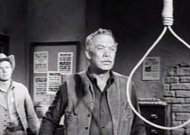 Ward Bond as Big Dan Halliday, finding a noose hanging in his sheriff's office in The Halliday Brand (1957)