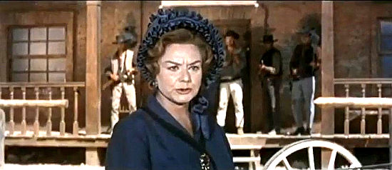 Paola Barbar as Eliza Anders, demanding her husband's killer be found in The Relentless Four (1965)