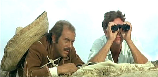 Partners Enrico Maria Salerno as Luca and Anthony Steffen as Gringo spy on Lobo's camp in Train for Durango (1968)