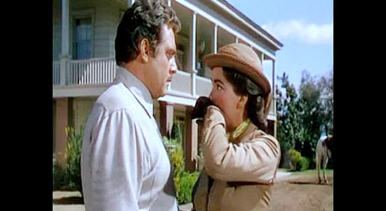 Raymond Burr as Cord Hardin, watching wife Lorna (Julie Adams) wipe away his kiss in Horizons West (1952)