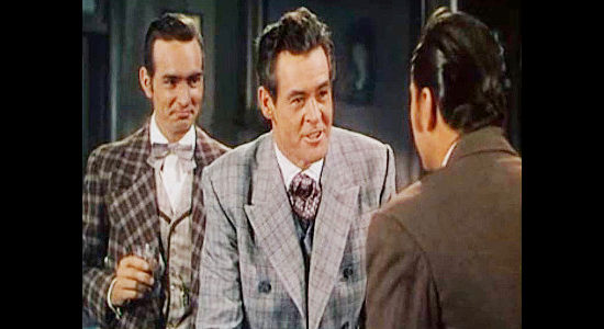 Robert Ryan as Dan Hammond, explaining his big plans for getting rich and richer as partner Dandy (Dennis Weaver) looks on in Horizons West (1952)