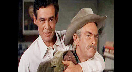 Robert Ryan as Dan Hammond, trying to use dad Ira (John McIntire) to get out of a jam in Horizons West (1952)