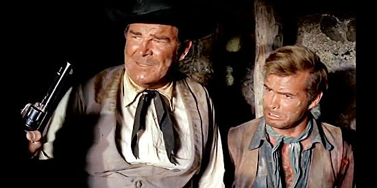 Rod Cameron as Pat Garret and Angel Aranda as George Clanton, cornered by Santera in Bullets Don't Argue (1964)