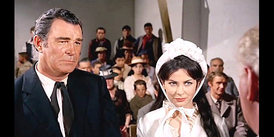 Rod Cameron as Sheriff Pat Garrett and Giulia Rubini (Judy Robbins) as fiance Martha Coogan on their wedding day in Bullets Don't Argue (1964)