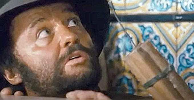 Rod Steiger as Juan Miranda, getting a close up look at the dynamite John Mallory plans to use on the bank in A Fistful of Dynamite (1971)