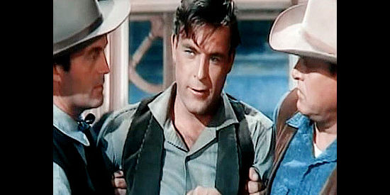 Scott Brady as Bob Dalon, in the hands of the law after a fit of jealousy over Belle Starr's apparant affectionf or Tom Bradfield in Montana Belle (1952)