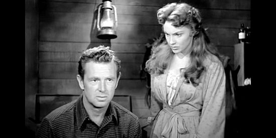Sterling Hayden as Gil Hanley, a veterinarian awaiting the birth of a colt with wife Ellen (Joan Leslie) in Hellgate (1952)
