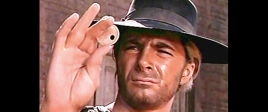 Tony Anthony as The Stranger accesses the odds in The Stranger Returns (1968)