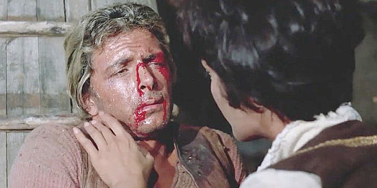 Tony Anthony as The Stranger, beaten and getting a helping hand in A Stranger in Town (1966)