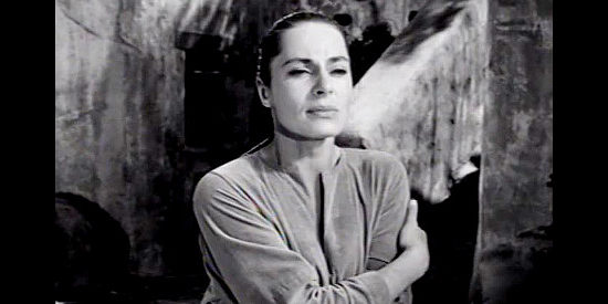 Viveca Lindfors as Aleta Burris, watching the man she loves ride off in The Halliday Brand (1957)