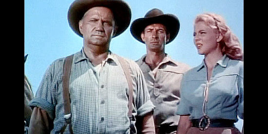 Walter Sande as Dennison, Jock Mahoney as Ross Granger and Peggie Castle as Ann Dennison surveying damage in Overland Pacific (1954)