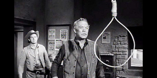 Ward Bond as Big Dan Halliday, finding a noose hanging in his sheriff's office in The Halliday Brand (1957)