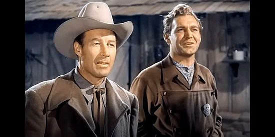 William Elliott as Zeb Smith and Forrest Tucker as Bucky, getting a surprise in Hellfire (1949)