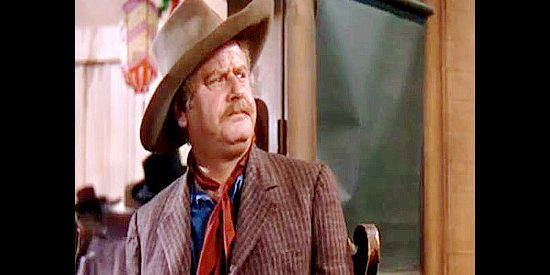 Alan Hale as Ruty, Wade Hatton's sidekick, trying to keep his temperance pledge in Dodge City (1939)