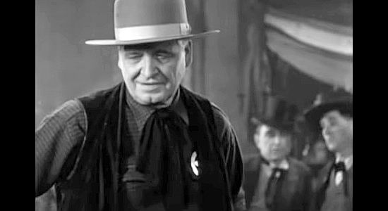 Alphonse Ethier as Fin Elder, the crooked sheriff who runs Tombstone in Law and Order (1932)