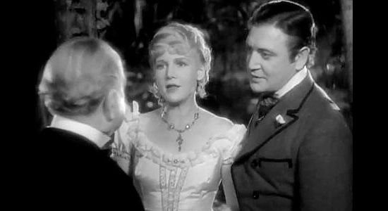 Ann Harding as Caroline and Richard Dix as Robert Standish, confessing their love to Caroline's father in The Conquerors (1932)