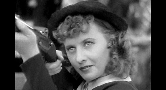 Barbara Stanwyck as Annie Oakley, earning her nickname Little Sure Shot in Annie Oakley (1935)