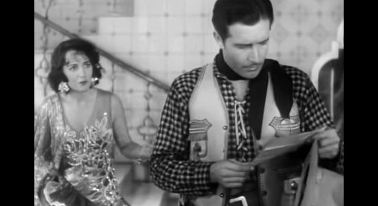 Bebe Daniels as Rita Ferguson, watching Jim Stewart's reaction to a letter regarding her brother in Rio Rita (1929)