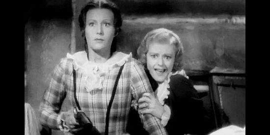 Binnie Barnes as Alice Munro and Heather Angel as Cora, watching Indians barge into the room where they're hiding in Last of the Mohicans (1936)