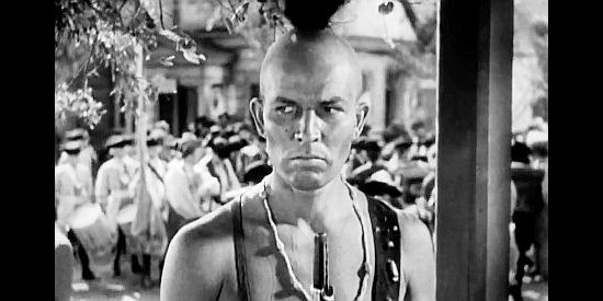 Bruce Cabot as Magua, making treacherous plans for the British he'll be guiding in Last of the Mohicans (1936)