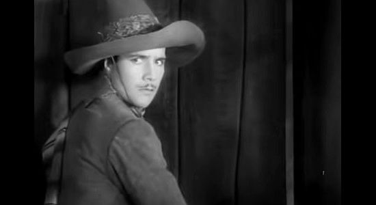 Don Alvarado as Robert Ferguson, searching for Gen. Ravinoff in Rio Rita (1929)