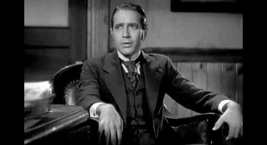 Donald Cook as Warren Lennox, Standish's son-in-law, causing the bank financial ruin in The Conquerors (1932)