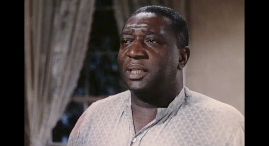 Ernest Whitman as Pinkie, breaking the news of Zee's departure to Jesse in Jesse James (1939)