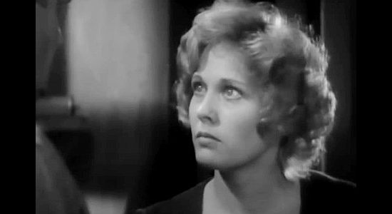 Esther Ralston as Ellen Colby, explaining how difficult life has been with her father in prison in To the Last Man (1933)