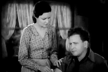 Gail Patrick as Ann Hayden Stanley, helping nurse a wound to her husband Neil (Barton MacLane) in To the Last Man (1933)